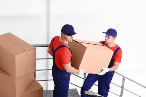 Removalists loading household furniture for a local move in Removalservices