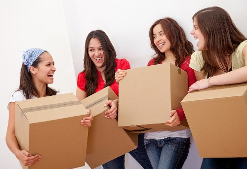 Removalservices van removal team handling boxes for a small home move