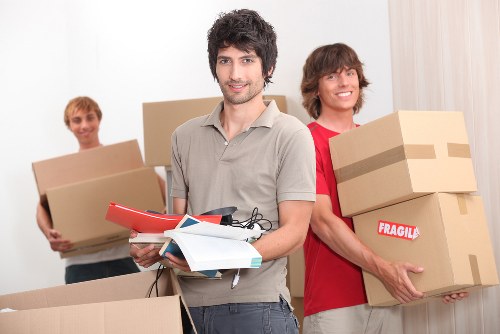 Professional man with van removals crew following safety procedures