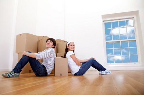 Removal vehicle and crew managing a residential move in Removalservices