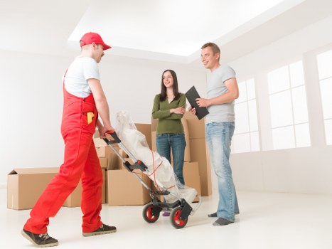 Packed boxes and furniture ready for a house move in Removalservices