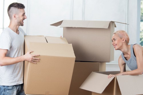 Professional van removals team managing boxes and furniture safely