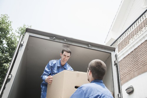 Moving team navigating stairs and access challenges in a Removalservices property