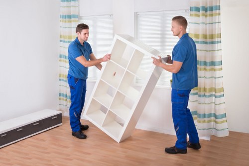 Packed office boxes and furniture ready for transport during a commercial relocation