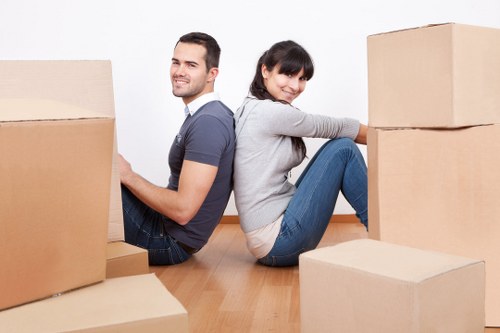 Packed boxes and furniture prepared for collection by a removal crew