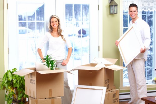 Professional movers navigating narrow access during a Removalservices relocation