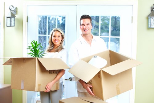 Packed office boxes and furniture ready for relocation